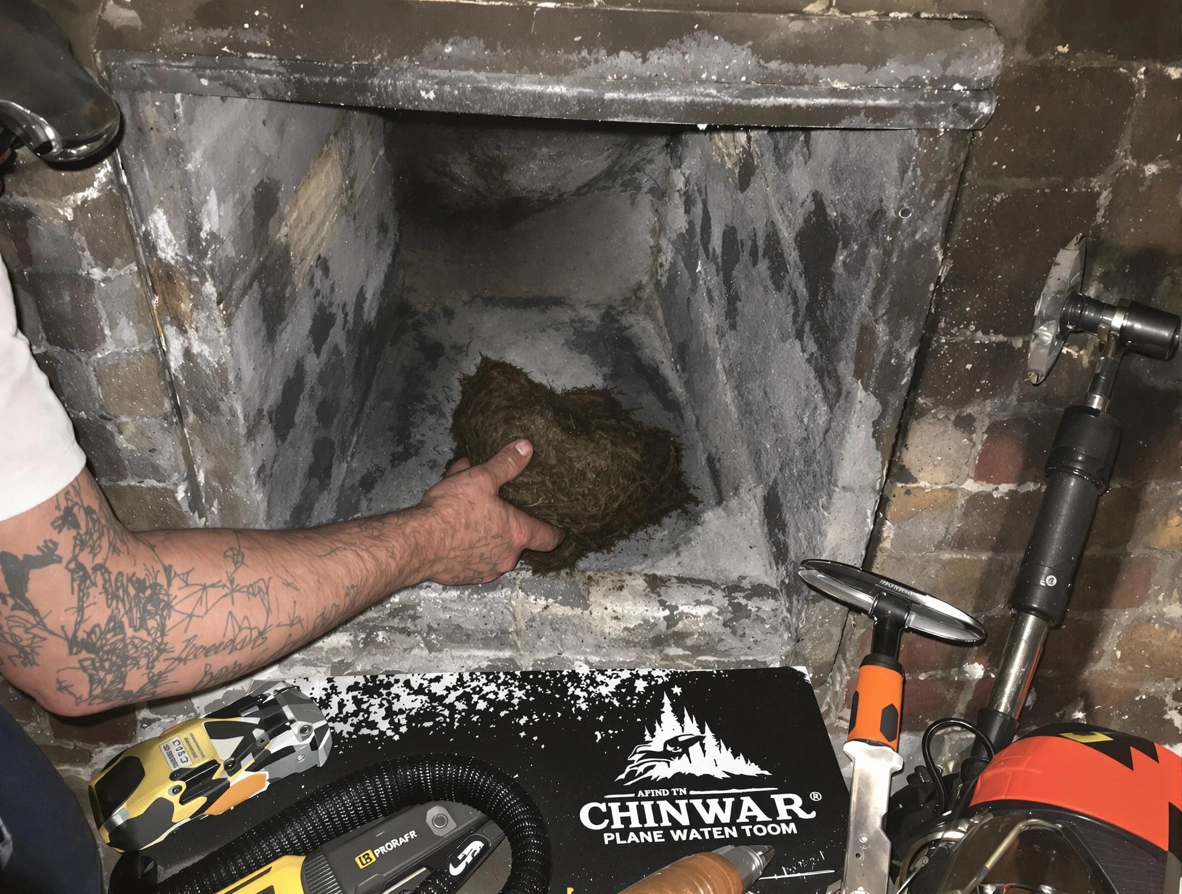 Chelsea Chimney Sweep safely removing debris and screening chimney in Chelsea, MA